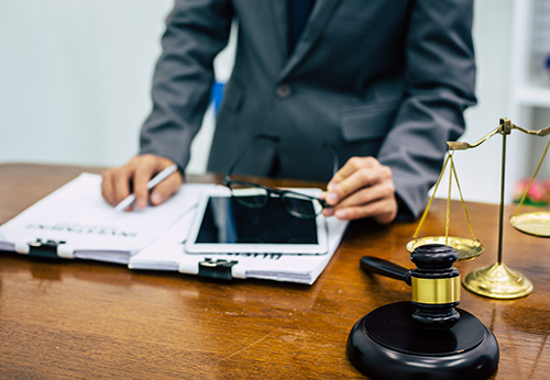 Attorney reviewing documents for business sale navigation in Mountain House.